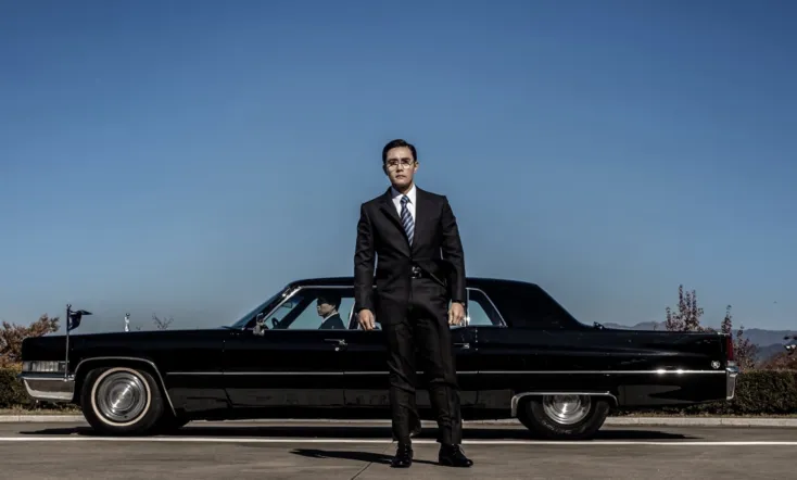 The Man Standing Next